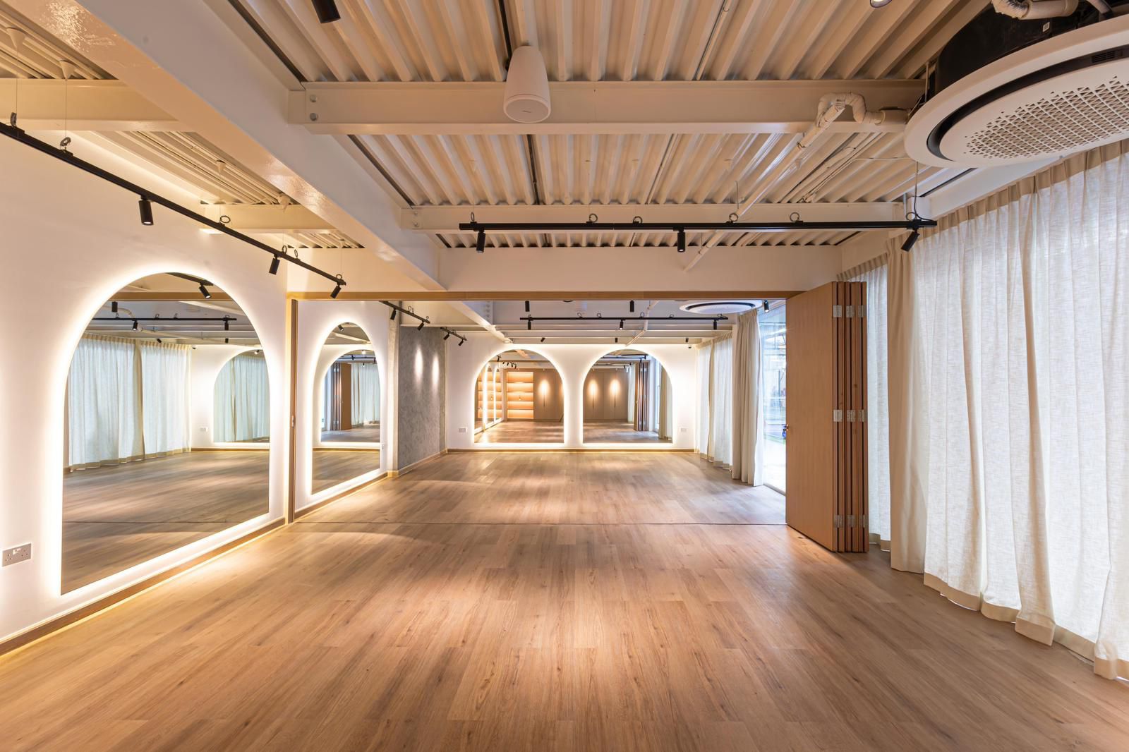 The Red Studio space bathed in warm light, ready for your private booking